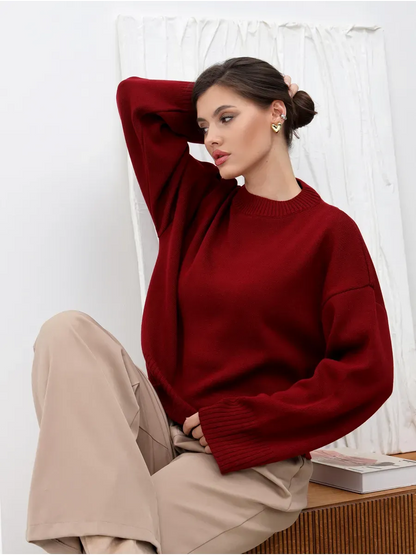 Valora Sweater in burgundy red worn by model, showcasing Lauven's oversized knit design for stylish comfort.