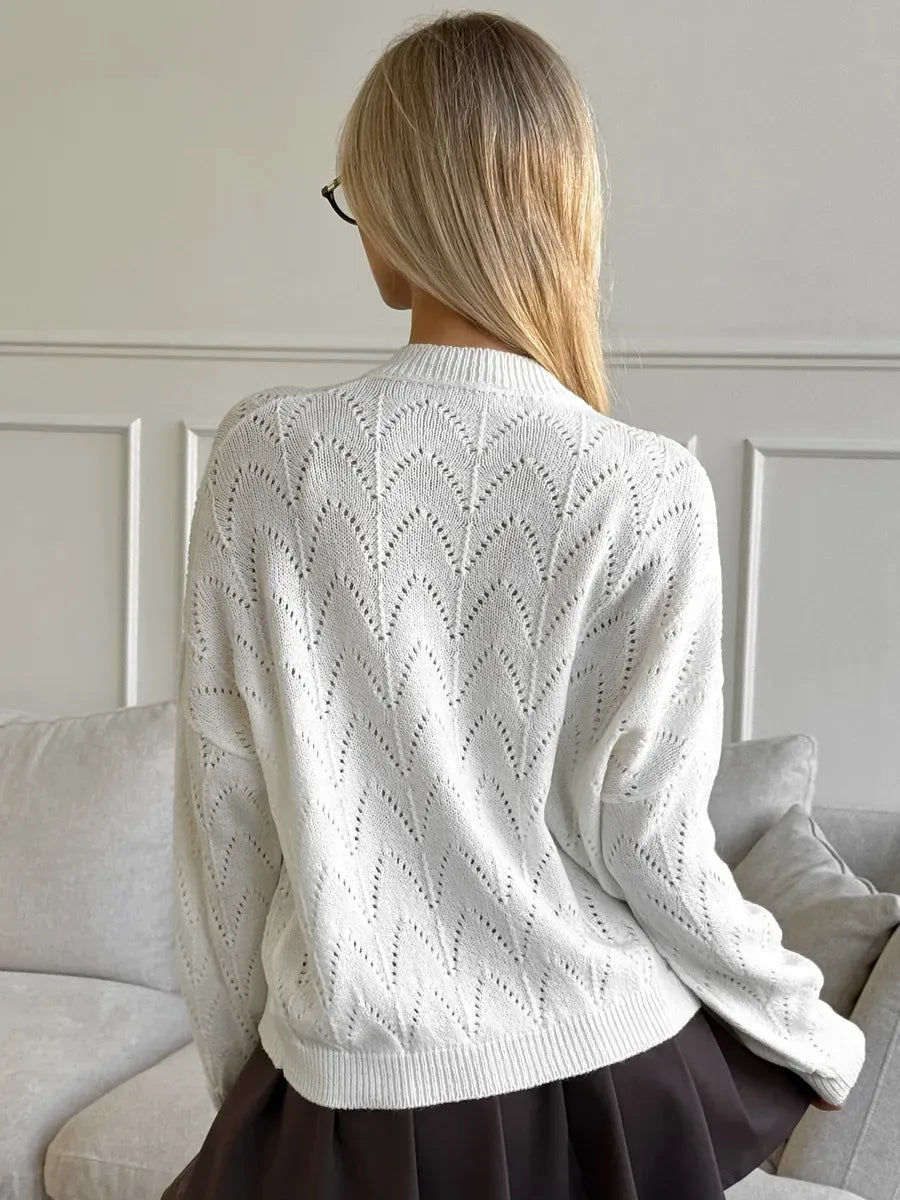 Ivory Cardigan by Lauven with delicate lace pattern seen from the back, highlighting its lightweight knit design.