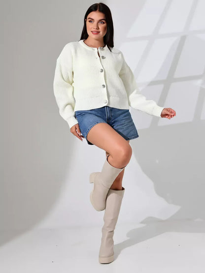 Luna Cardigan by Lauven showcasing elegant warm knitwear for women, styled with denim shorts and knee-high boots.