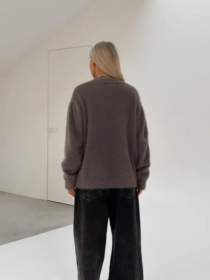 Vega Cardigan by Lauven, oversized gray fluffy knit cardigan displayed from the back view.