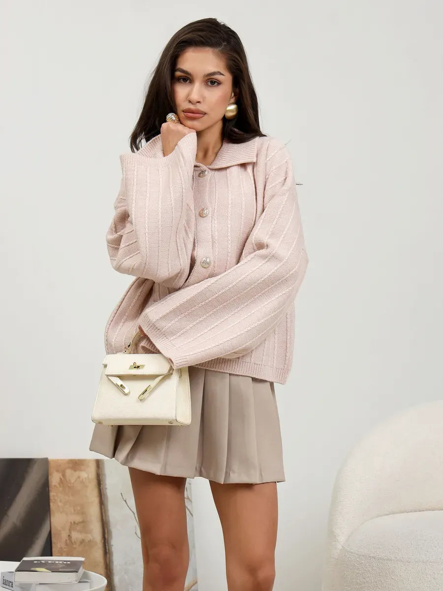 Serene Cardigan by Lauven in powder pink, showcasing elegant oversized knitwear with braided detail.