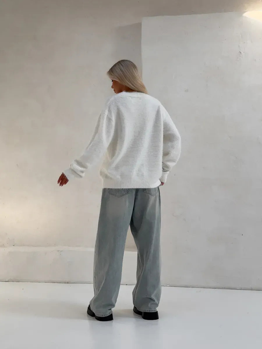 Luna Cardigan by Lauven, oversized white fluffy knit cardigan worn with relaxed pants, showcasing cozy luxury and effortless style.