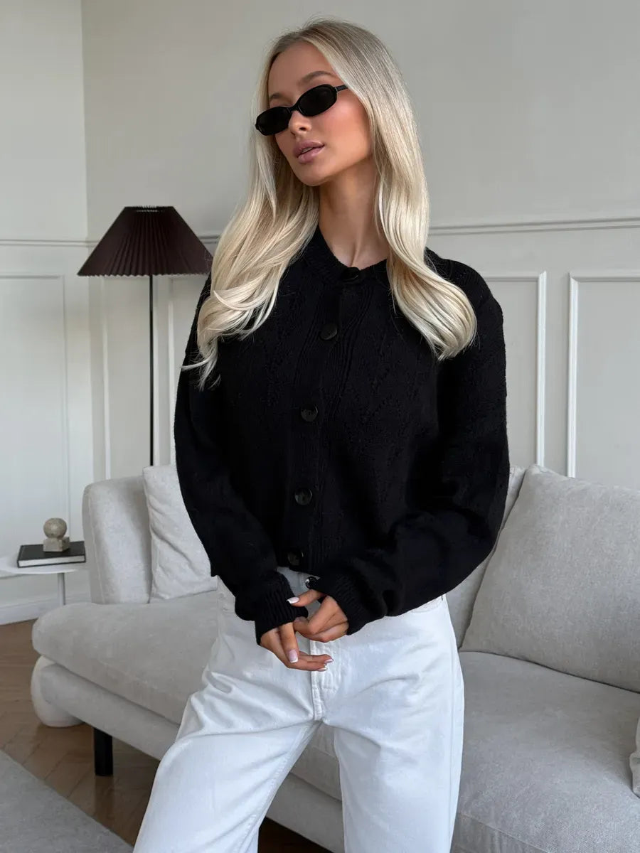 Onyx Cardigan by Lauven, featuring a stylish button-up design and soft textured fabric, worn with chic sunglasses.