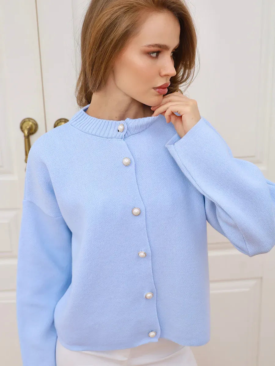 Celeste Cardigan by Lauven in light blue with pearl button closure, stylish and versatile for any wardrobe.