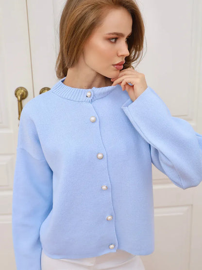 Celeste Cardigan by Lauven in light blue with pearl button closure, stylish and versatile for any wardrobe.