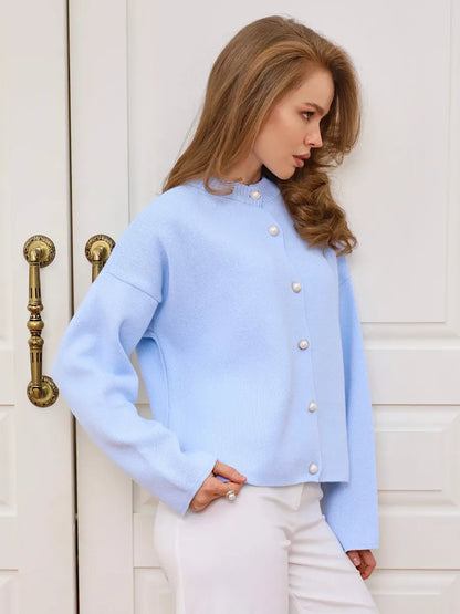 Celeste Cardigan by Lauven - Light Blue Knit with Pearl Button Closure, perfect for spring and summer styling.