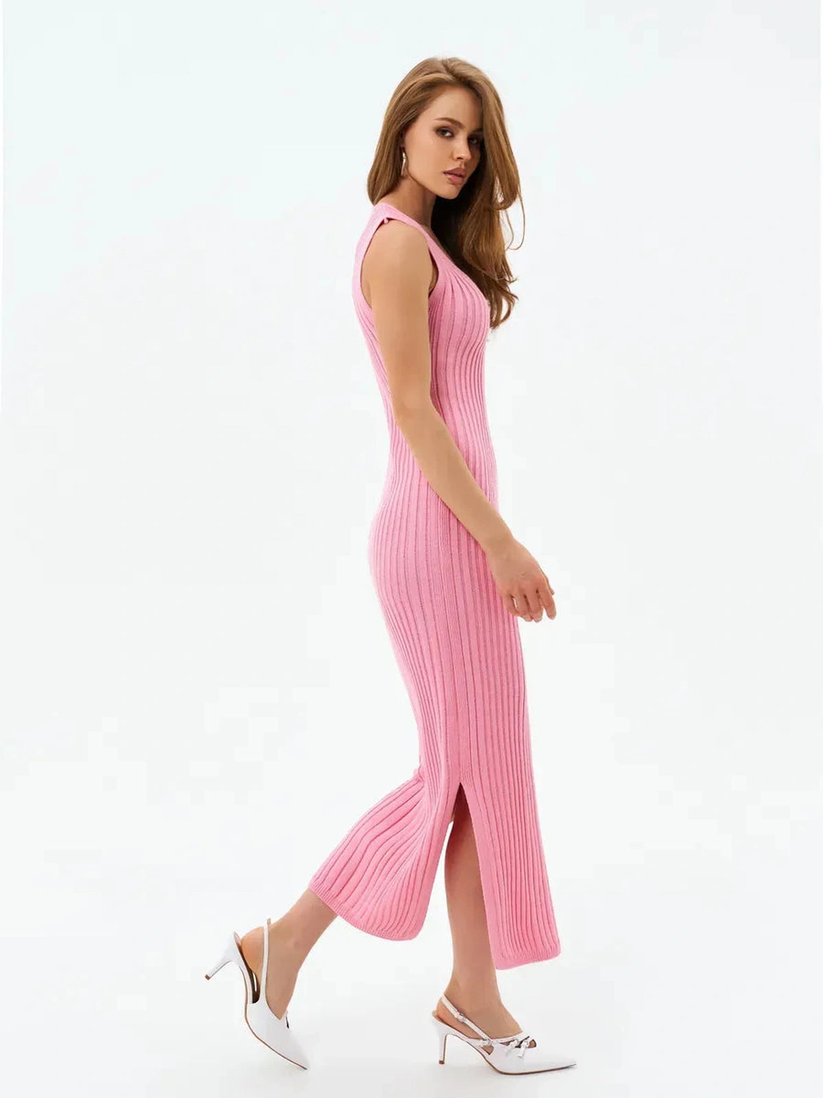 Rosalie Midi Dress by Lauven, showcasing a soft pink ribbed knit design with a side slit and V-neckline.