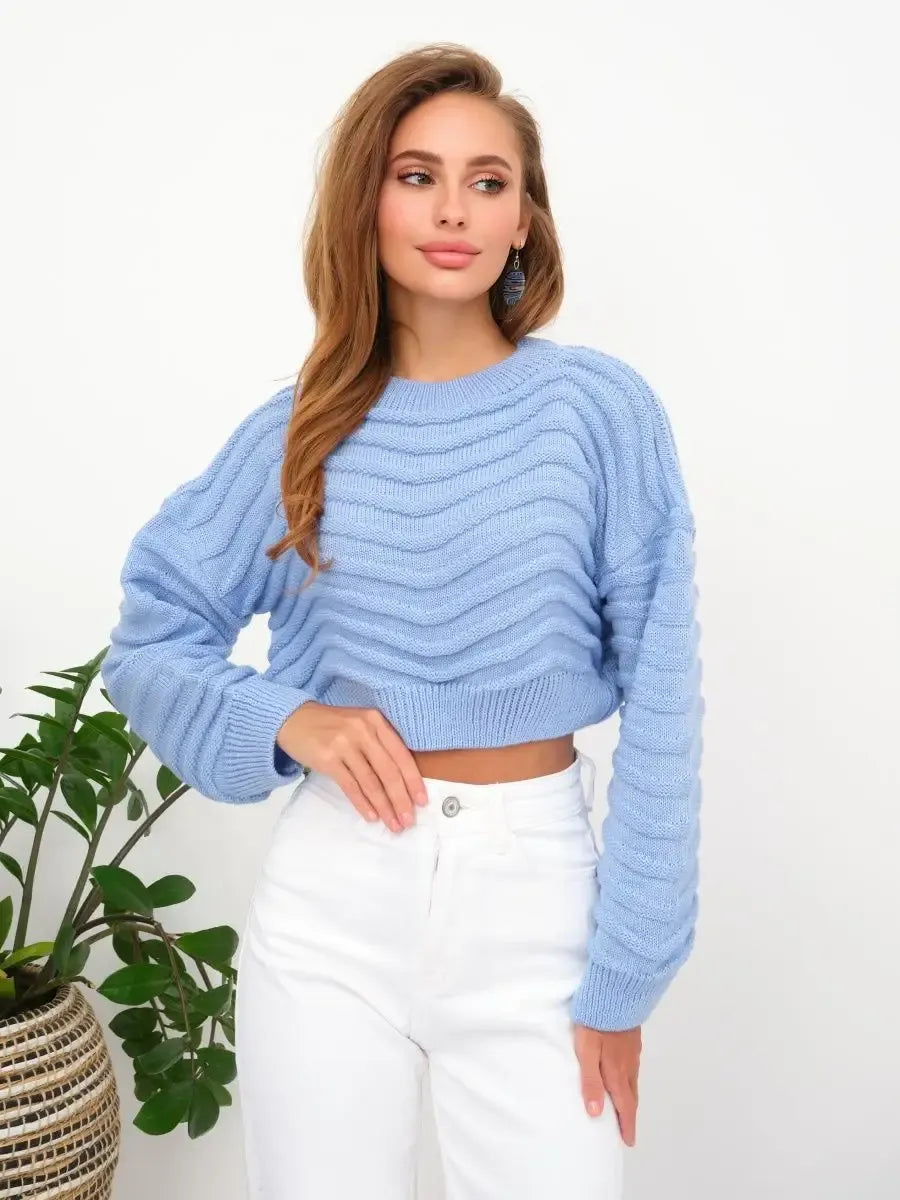 Celeste Sweater by Lauven in soft sky blue, featuring a textured wave-knit pattern and a cropped relaxed silhouette.
