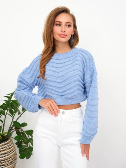 Celeste Sweater by Lauven in soft sky blue, featuring a textured wave-knit pattern and a cropped relaxed silhouette.