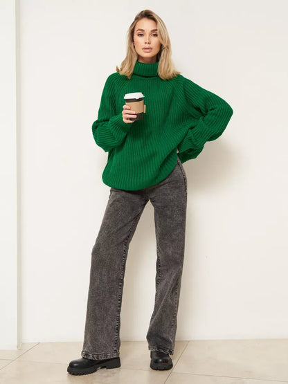 Emerald Sweater by Lauven, oversized green knitwear with turtleneck, worn with gray jeans and holding coffee.