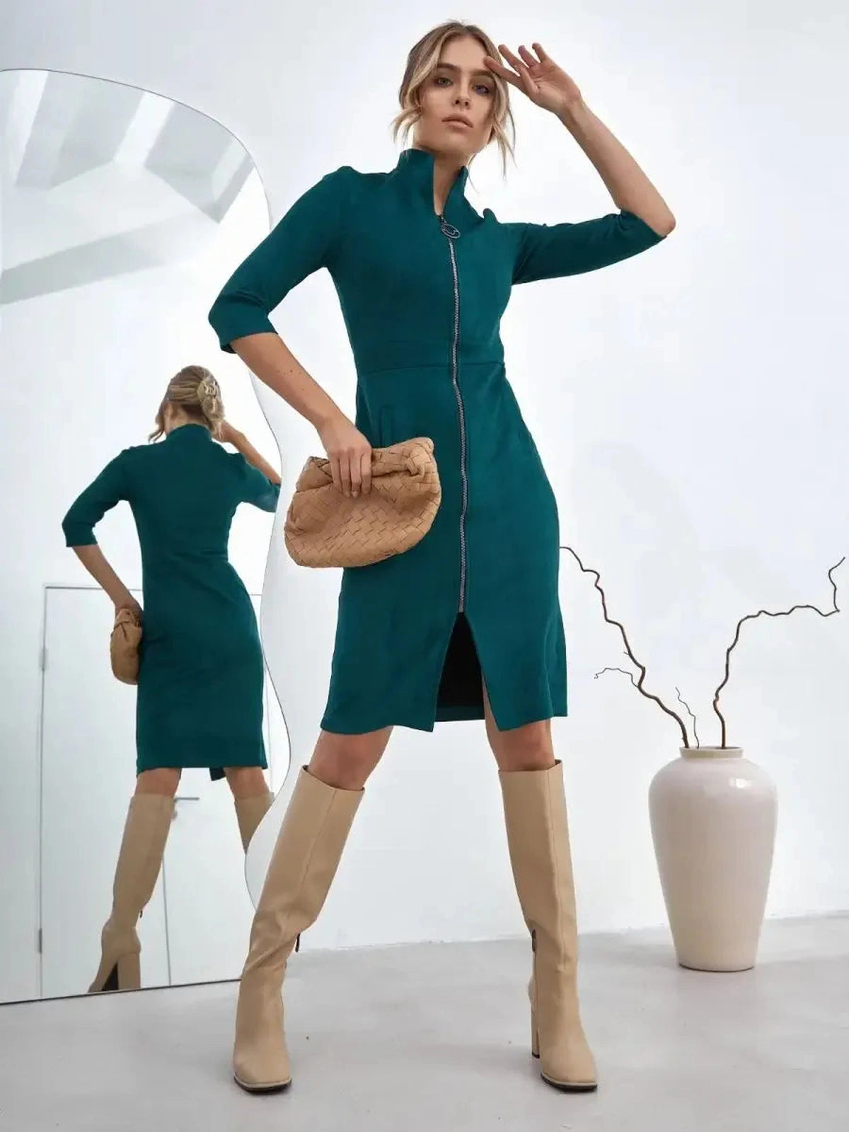 Avalon Mini Dress by Lauven - Sleek zip-front silhouette in teal, exuding modern structured elegance.