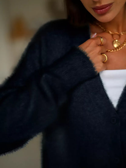 Obsidian Cardigan by Lauven featuring plush black oversized knitwear with button closure and relaxed fit.