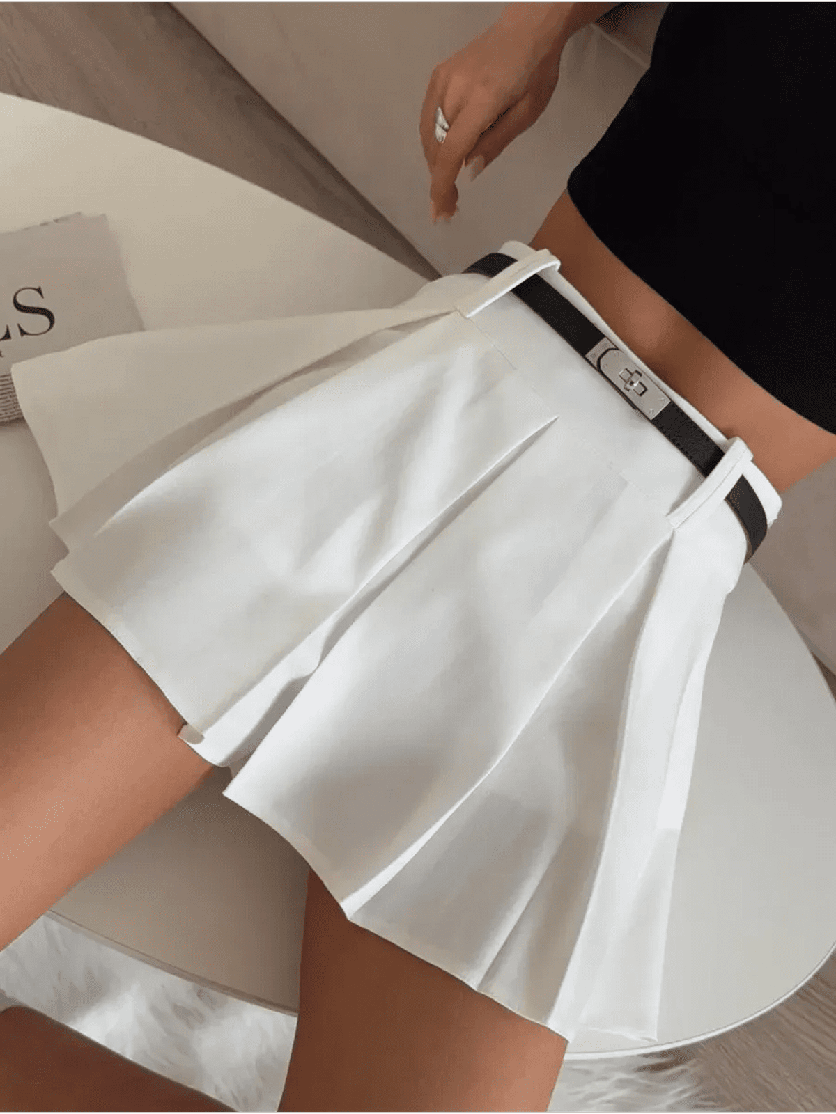 Capri Mini Skirt by Lauven, high-waisted pleated white skort with built-in shorts, perfect for stylish, versatile wear.