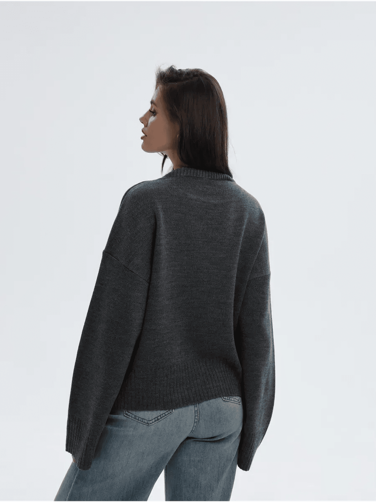 Aria Sweater by Lauven, oversized knit in anthracite gray, showcasing a stylish back view on a model.