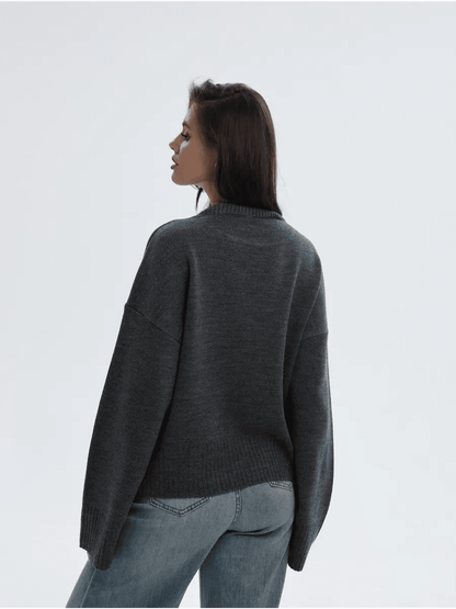Aria Sweater by Lauven, oversized knit in anthracite gray, showcasing a stylish back view on a model.