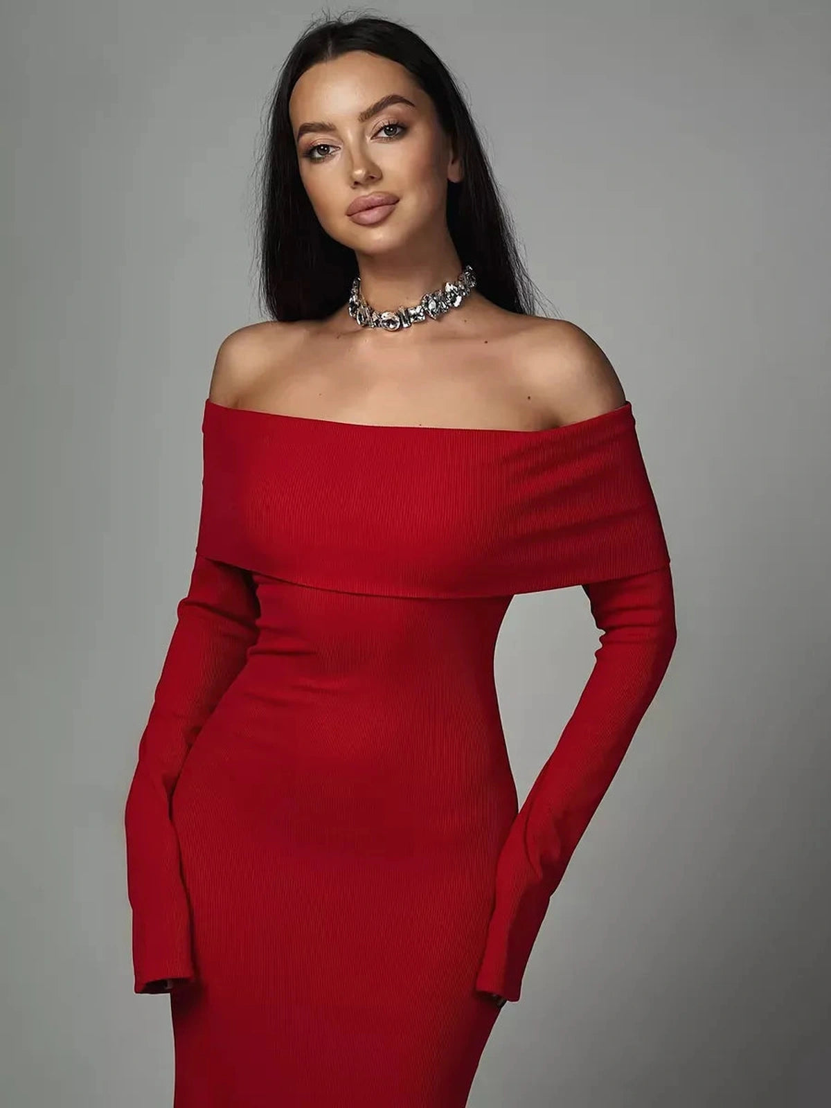 Valoria Maxi Dress by Lauven worn by a model, showcasing off-shoulder design in radiant red.