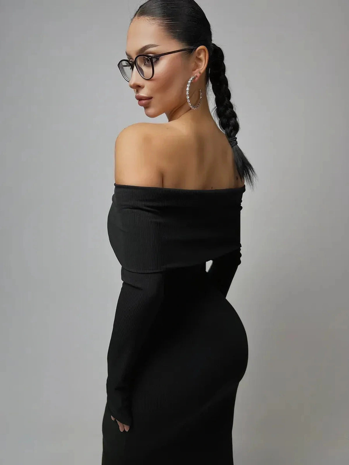 Noctara Maxi Dress by Lauven features an off-shoulder design and sculpting silhouette in elegant deep black.