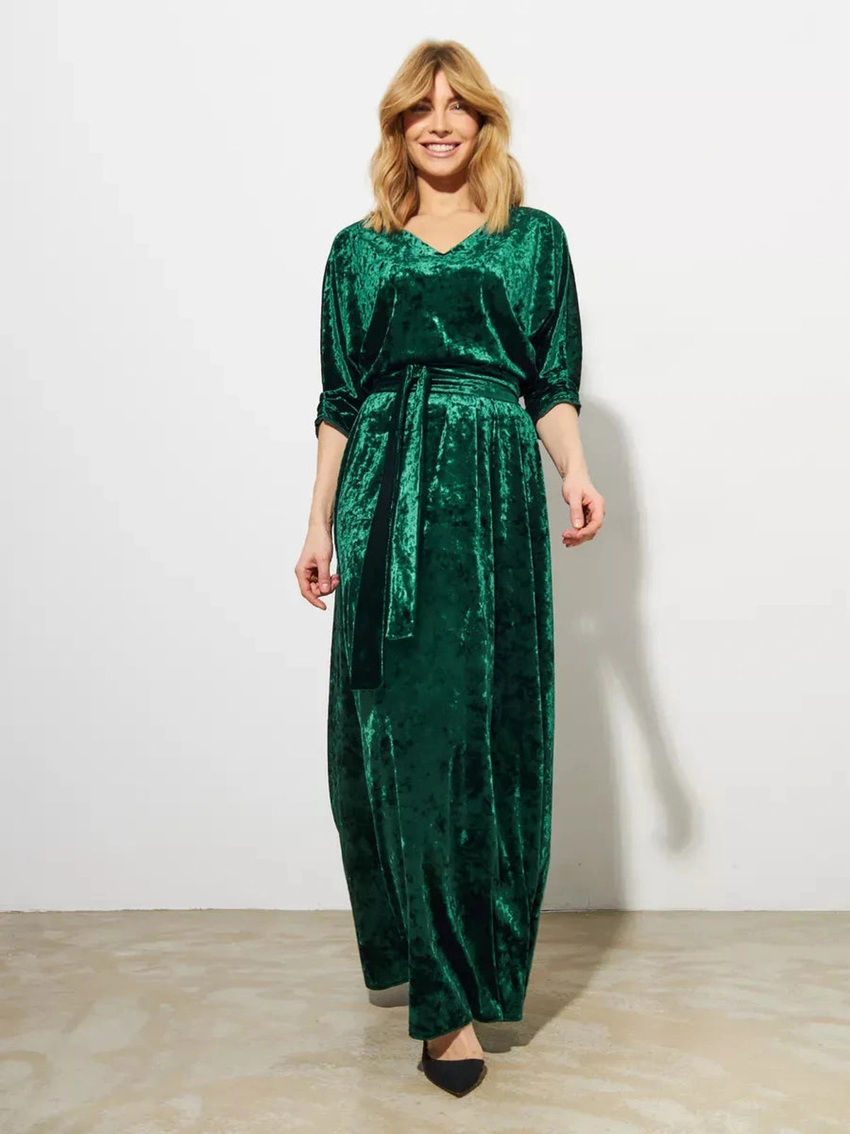 Emerelle Maxi Dress by Lauven, a stunning emerald green A-line gown in plush crushed velvet.
