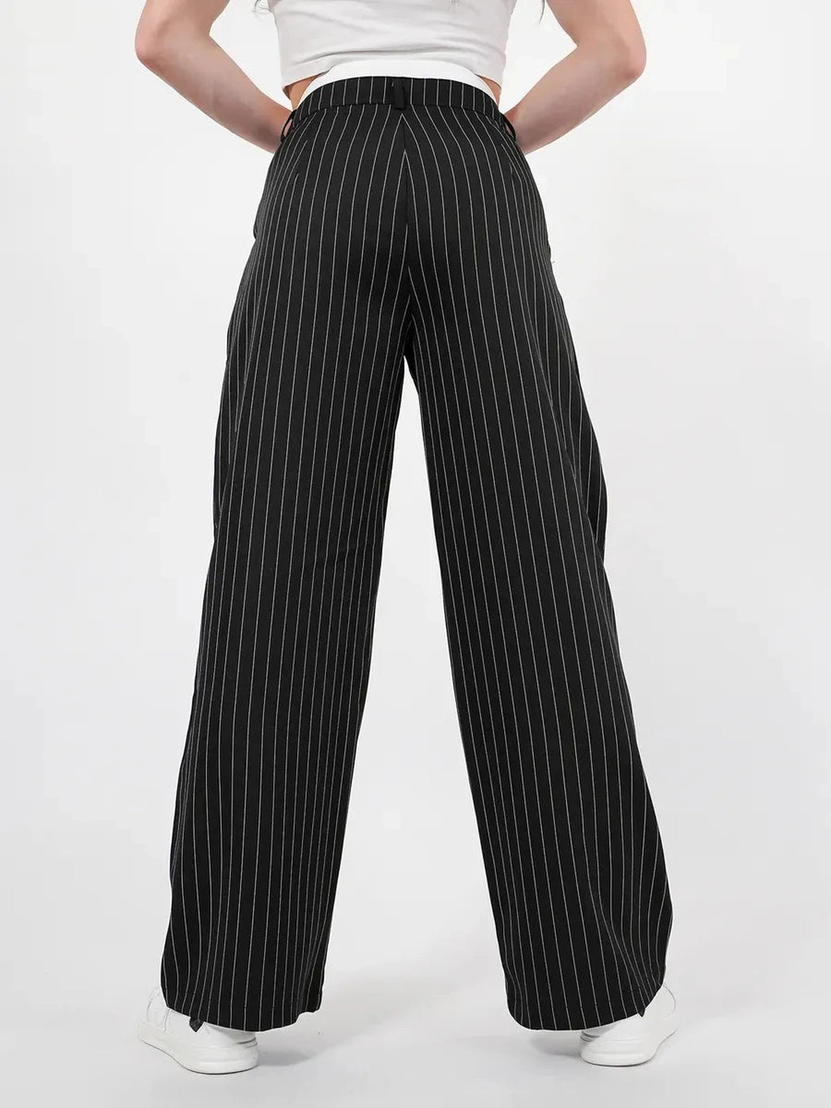 Back view of a model wearing Lauven Orion Pinstripe Pants with high-waist and wide-leg tailored silhouette.