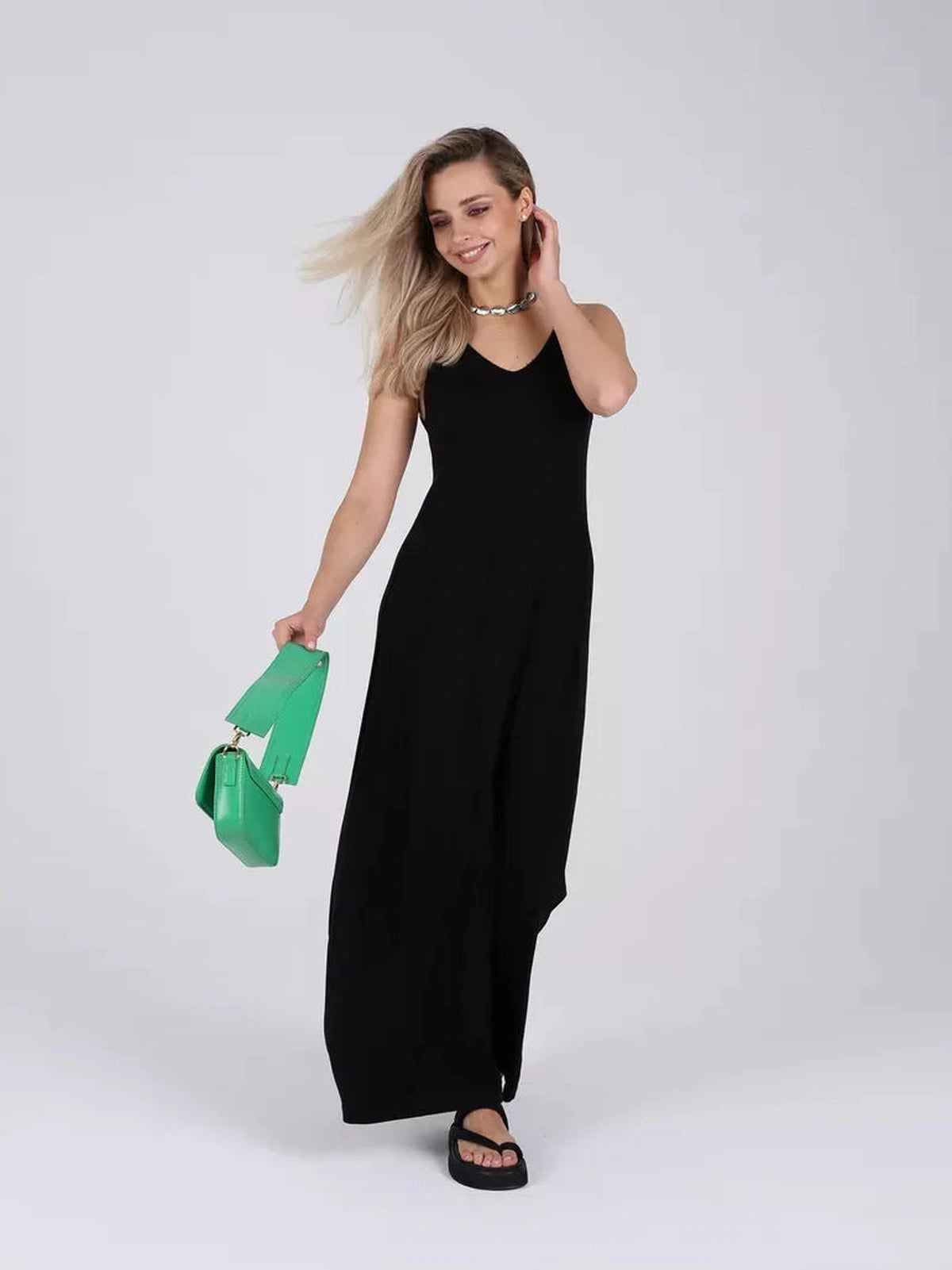 Noiré Maxi Dress by Lauven, a classic black knit dress with elegant A-line silhouette and stylish accessories.