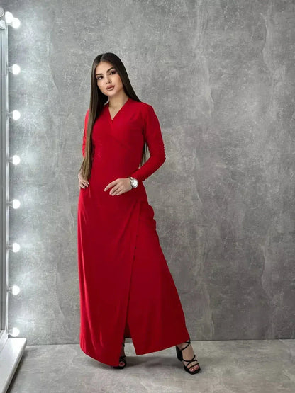 Model wearing a long sleeve red maxi dress with a wrap silhouette, highlighting its elegant and sophisticated design.