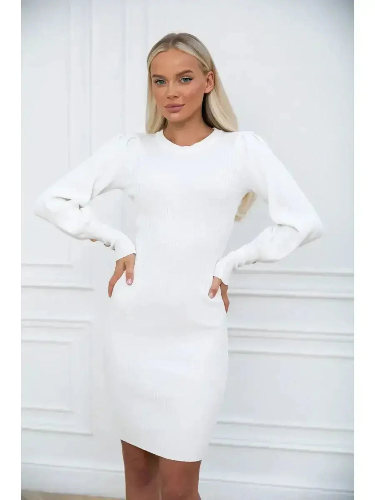 Ivory Curve long sleeve white mini dress with voluminous sleeves and structured cuffs, showcasing modern elegance and timeless style.