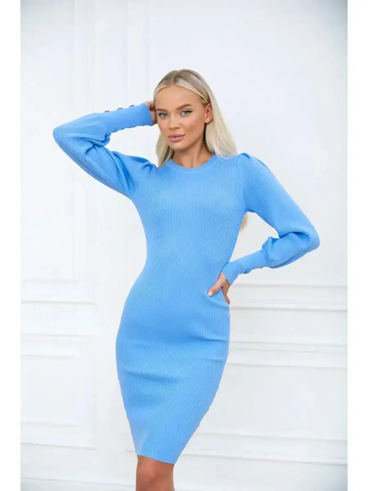 Azure Mini Dress with long sleeves showcasing a fitted silhouette and ribbed texture against a minimalist backdrop.