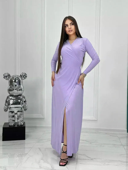 Lilac Mirage Maxi Dress with wrap design, long sleeves, and high side slit in a chic setting.
