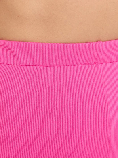 Close-up of the ribbed fabric of the Fuchsia Two-Piece Set by Lauven, showcasing its vibrant color and texture.