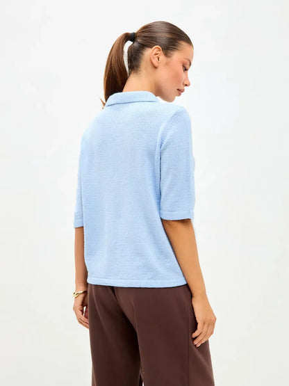 Alba Cardigan by Lauven – Lightweight blue wool blend knitwear with short sleeves and button closure.