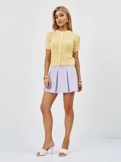 Solara Cardigan by Lauven in soft yellow, featuring breathable knitwear with a stylish short-sleeve design.