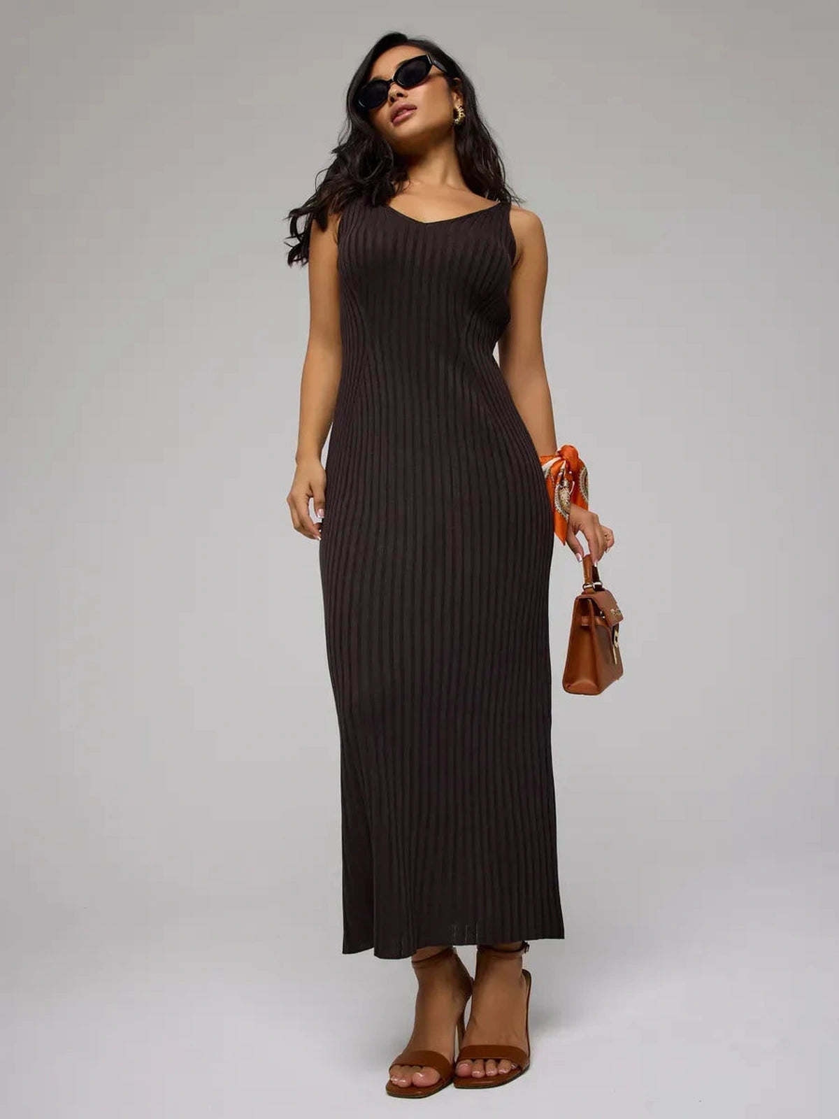 Model showcasing the Cacao Maxi Dress from Lauven, a chic brown ribbed knit dress perfect for any occasion.