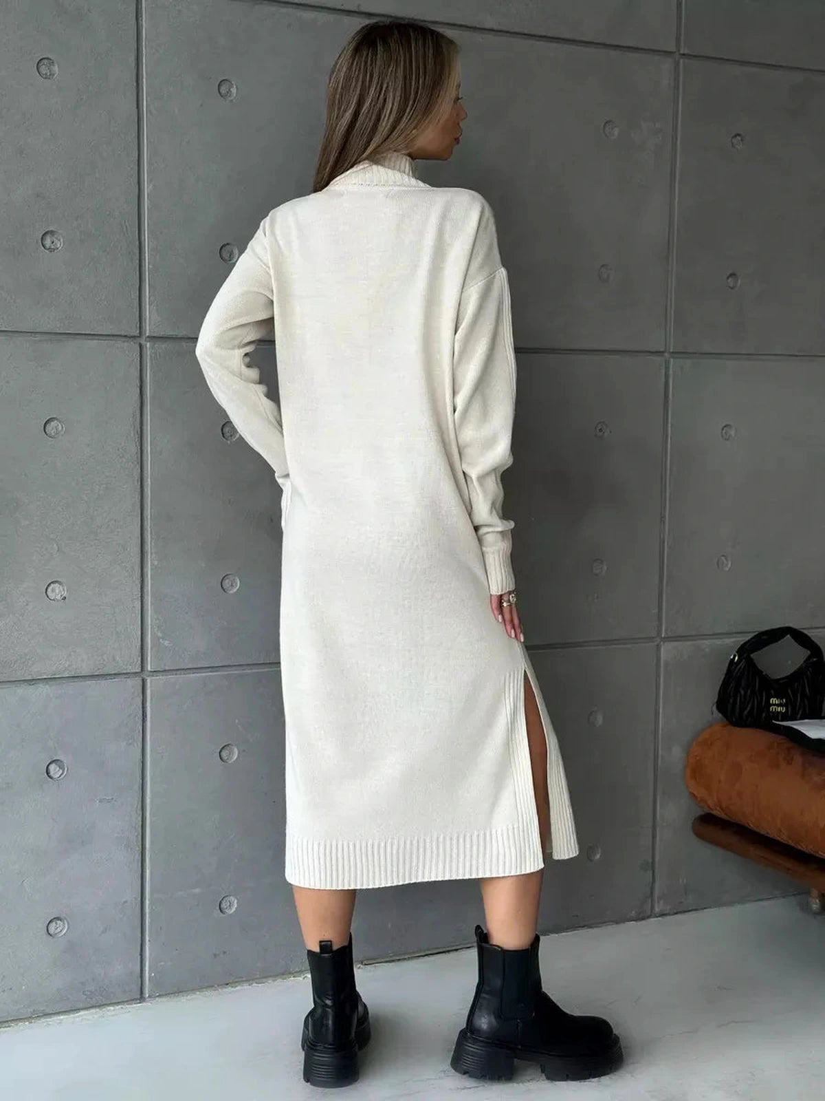 Celeste Midi Dress by Lauven, showcasing back view with side slit, in soft beige knit fabric.