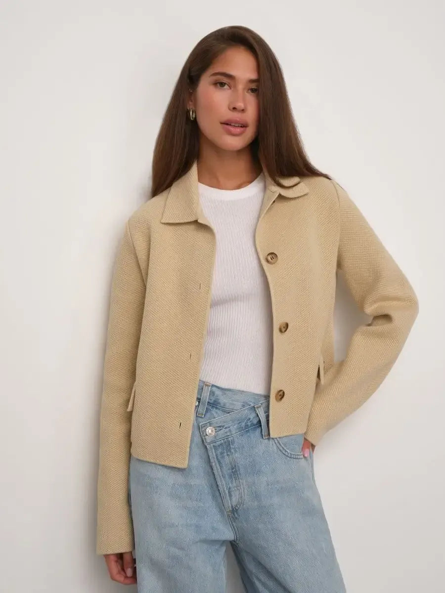 Alba Jacket by Lauven in light beige, cropped silhouette with button closure, styled for modern elegance.