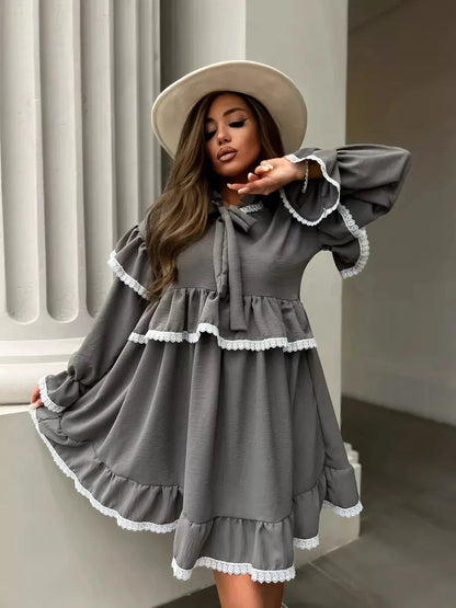 Lauven Luna Mini Dress in grey with elegant ruffled design and lace trim, perfect for special occasions.