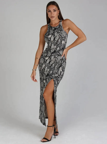 Nerine Maxi Dress by Lauven, featuring a striking snakeskin print and elegant side slit, showcasing bold sophistication.