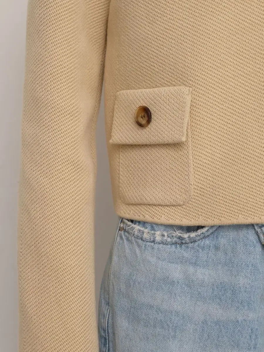 Alba Jacket by Lauven, cropped light beige women’s jacket detail with button and pocket.