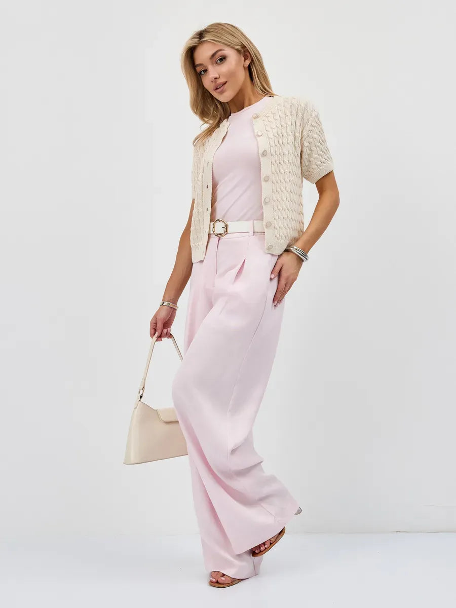 Lumiere Cardigan by Lauven worn with a pink outfit, showcasing lightweight cotton-acrylic knitwear for stylish looks.