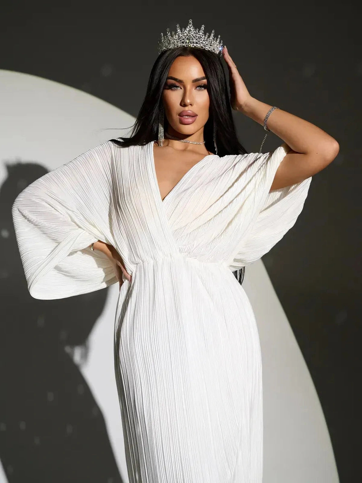 Selene Midi Dress by Lauven featuring elegant pleats, flowing silhouette, and deep V-neckline.