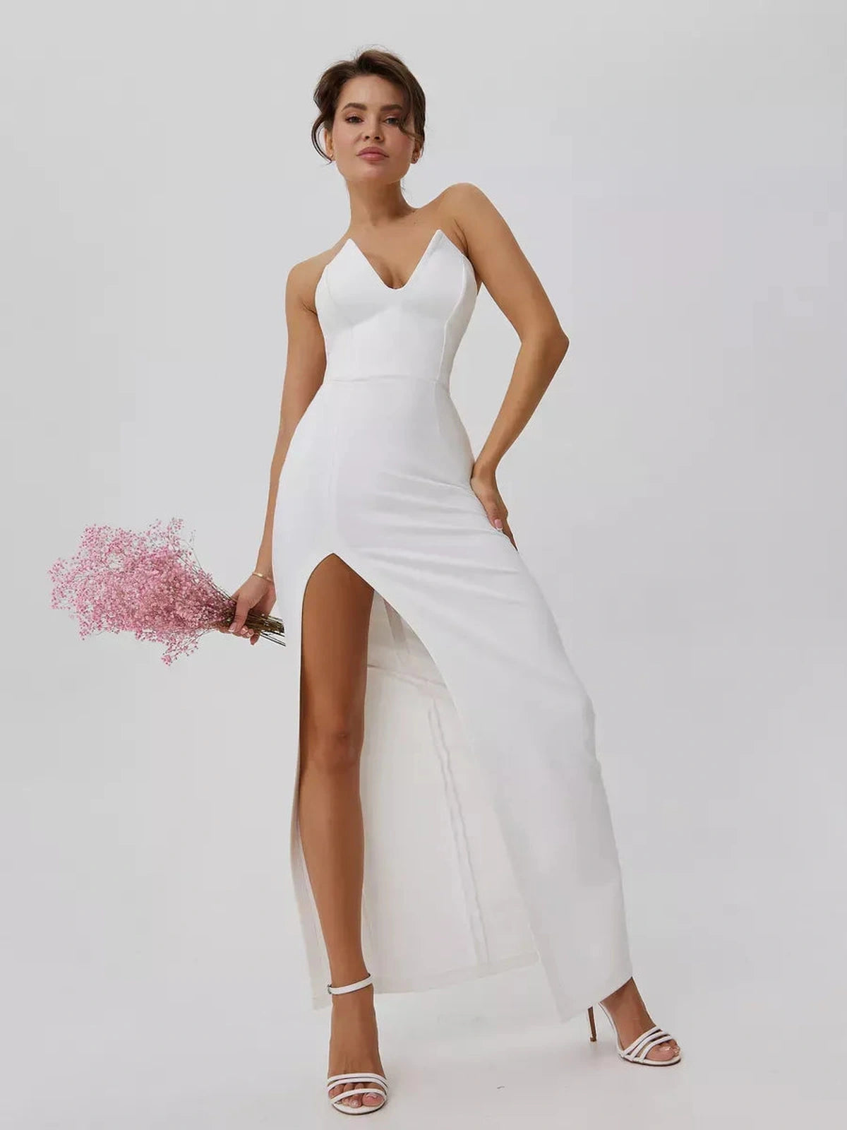 Lunaria Maxi Dress by Lauven, showcasing minimalist elegance with a sculpted fit and front slit in pristine white.
