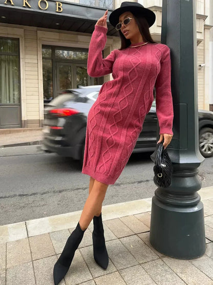 Model wearing the Berry Midi Dress by Lauven, showcasing the elegant textured knit in rich berry on the street.