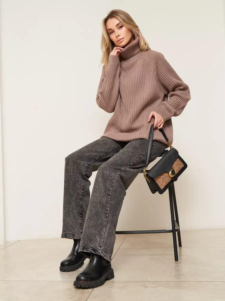 Sable Sweater by Lauven, oversized brown knitwear with turtleneck, stylishly paired with jeans and handbag.