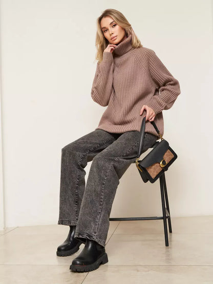Sable Sweater by Lauven, oversized brown knitwear with turtleneck, stylishly paired with jeans and handbag.