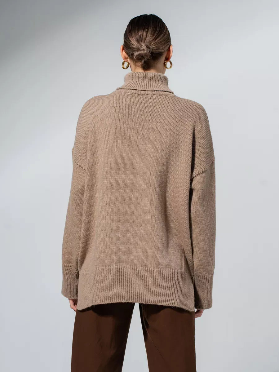Back view of the Capri Sweater by Lauven, an oversized knit with a turtleneck collar in warm cappuccino shade.