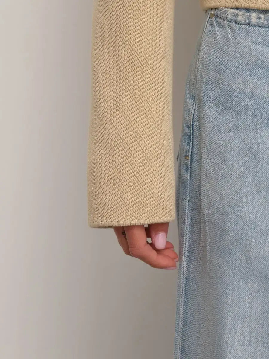 Alba Jacket sleeve detail showcasing light beige fabric and stylish design by Lauven.