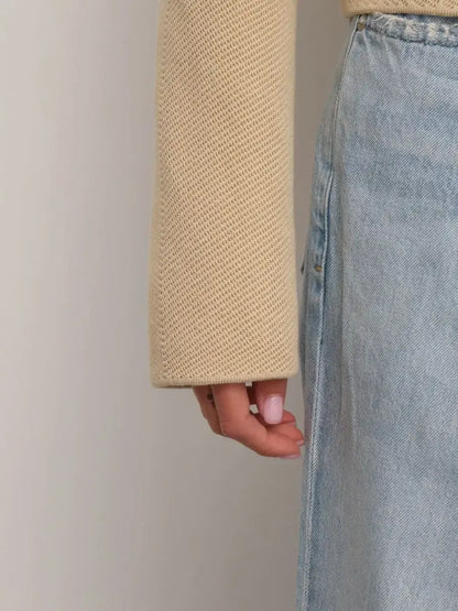 Alba Jacket sleeve detail showcasing light beige fabric and stylish design by Lauven.