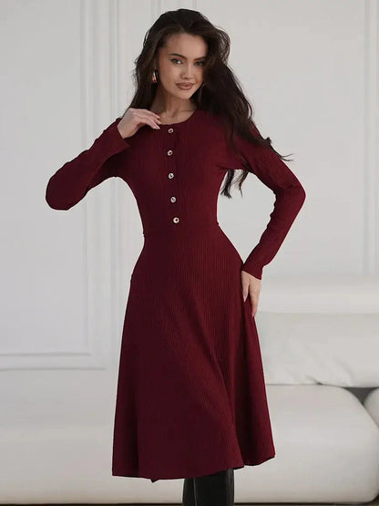 Crimson Grace Midi Dress in ribbed burgundy with gold buttons, showcasing elegance and versatility.
