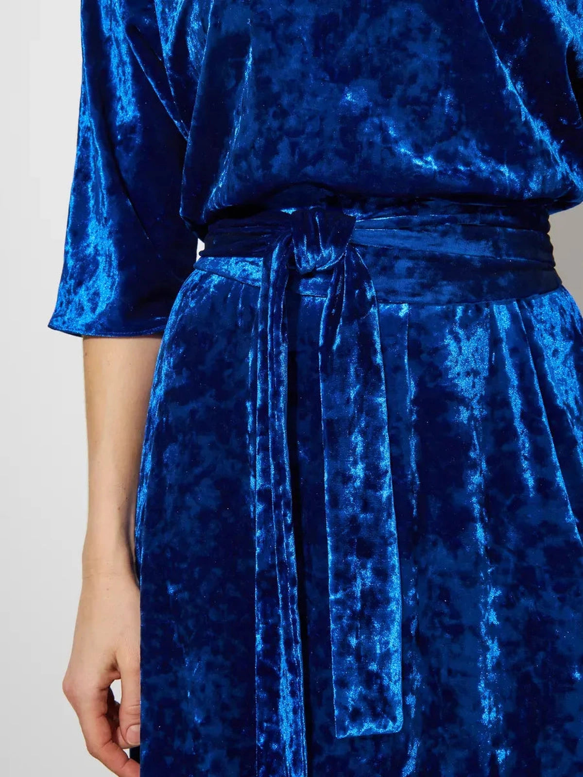 Celestia Maxi Dress by Lauven showcasing luxurious sapphire crushed velvet fabric and matching belt detail.