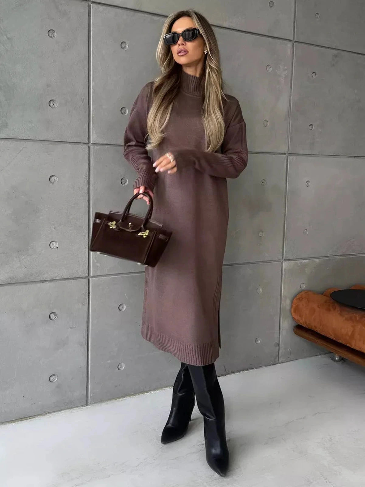 Model showcasing the Noirra Midi Dress by Lauven in cocoa brown with structured high-neck collar.