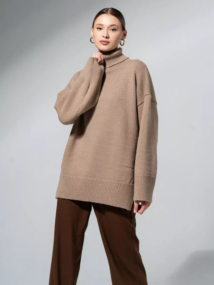 Model showcasing the Capri Sweater by Lauven, an oversized knit with turtleneck collar in warm cappuccino shade.